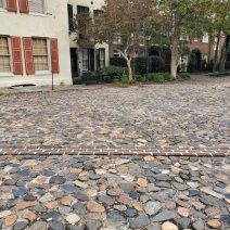 Charleston is one of the few cities in North America to ever have been a walled city. In the early 1700's, the wall protected the residents from everything from pirates to the Spaniards and French. While the wall has been mapped, there are only a few spots where you can actually see its remnants. The brick line here, across the cobbles of North Adgers Wharf, represents where the wall crossed at that point -- and if you dig down you will find it (but do not do that without permission and proper archaeological processes!)