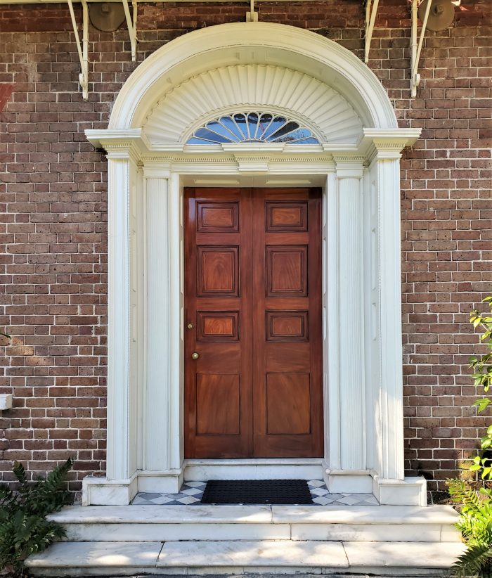 This door belongs to the Nathaniel Russell House on Meeting Street. Considered one of the finest examples of Neoclassical architecture in the United States, this house is now open to the public and maintained as a museum by the Historic Charleston Foundation. It's very much worth the visit.