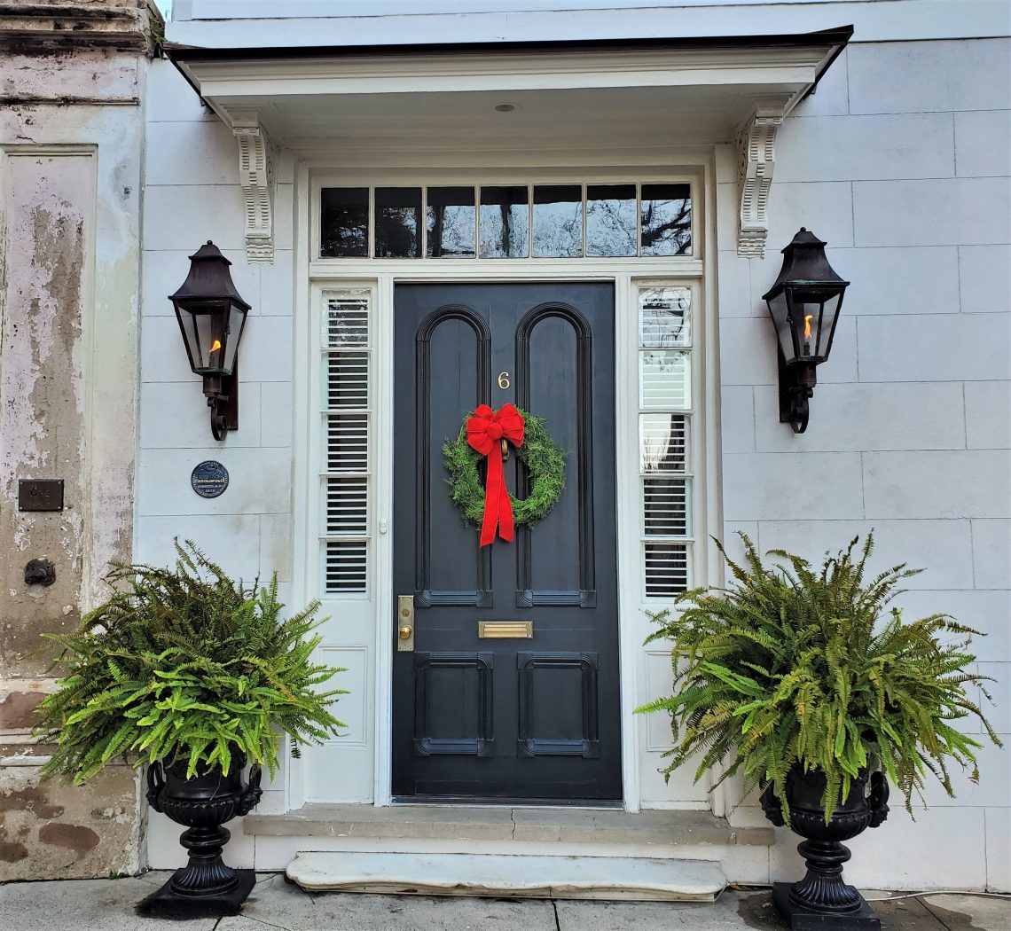 This beautiful front door scene, complete with some cool gas lights, is on Legare Street.