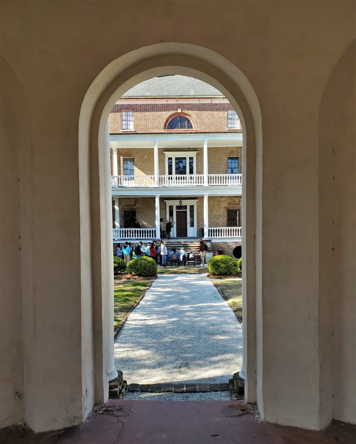 A different view of the Joseph Manigault House through the door of the garden "folly."