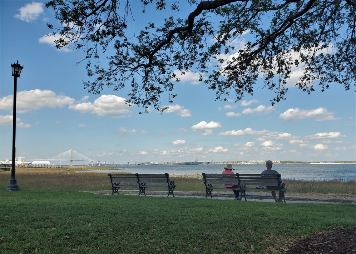 Charleston is the first city in South Carolina to close their parks and and order people to stay home (unless on essential business or exercising). This photo was taken two days before the order went into effect, but some good social distancing in practice -- even between this couple.