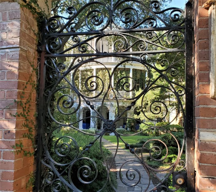 This beautiful gate/house combo is on Gibbes Street. The current owners used to let roosters roam the property. They honored those birds by placing statues of roosters on top of the gate posts. 