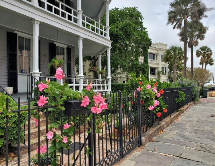 This classic Charleston scene on Atlantic Street is in front of a house that was built in 1890 -- one of two identical ones that replaced a larger house that had been destroyed in an earthquake.